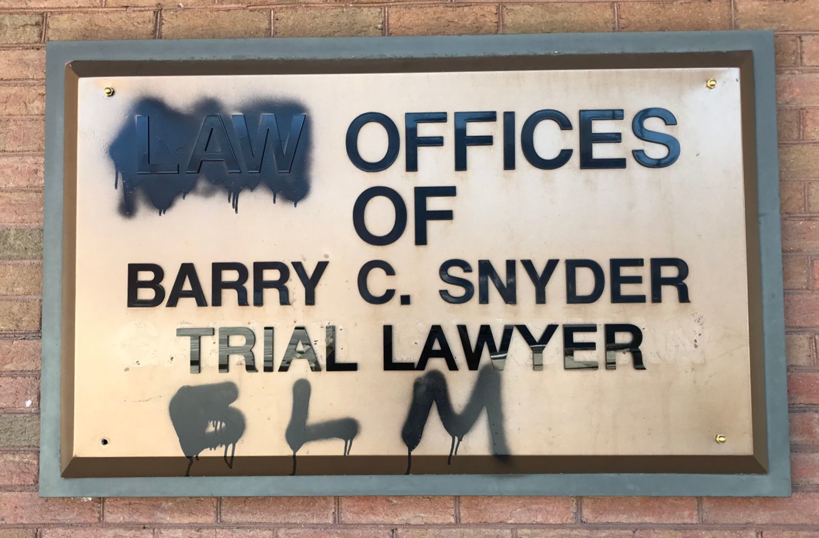 Downtown Greensboro damage - Barry Snyder sign